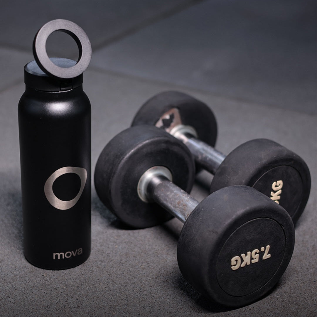 mova black insulated bottle in gym setting